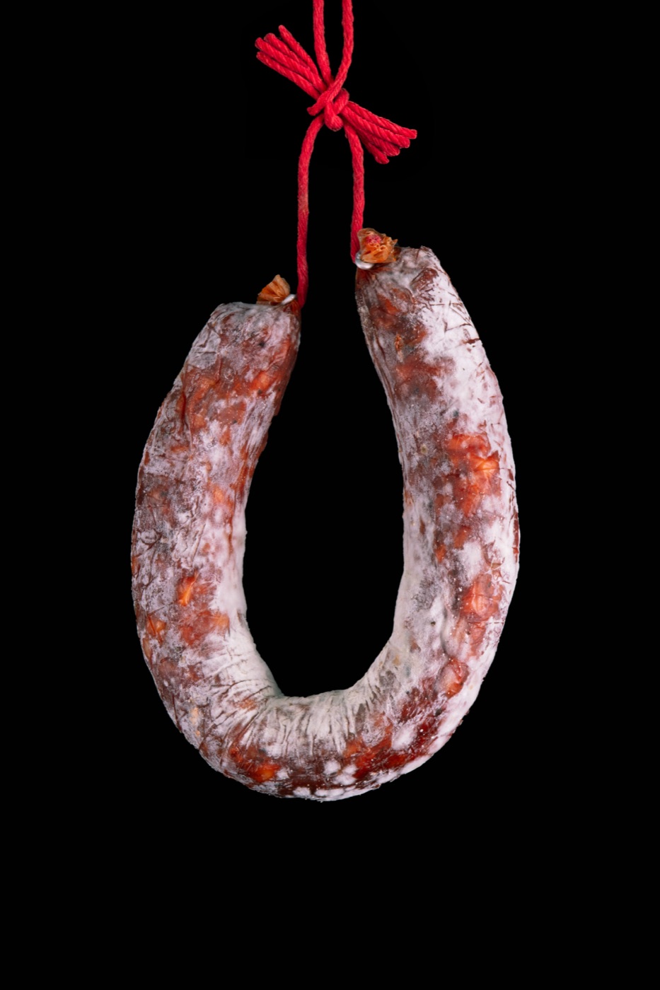 Iberian chorizo, hung to cure